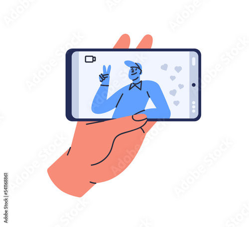 Video call via mobile phone. Hand holding smartphone with videocall app on ho...