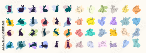 Big set of different black rabbits silhouettes, isolated on a colorful background for design use. Silhouettes of New Years bunnies in simple one line style. 2023 year of the rabbit. Christmas vector
