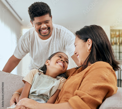 Tableau sur toile Family, mother and daughter hug with father standing at lounge sofa in Philippines home