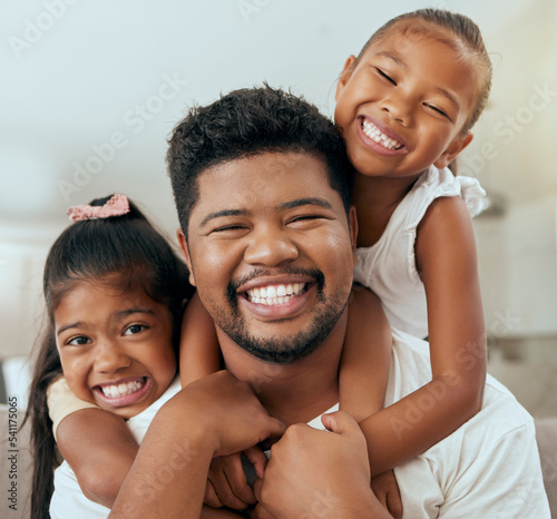Family, father and children, hug and happy together in portrait at family home while spending quality time. Filipino man, girl and smile, kids and dad hugging, bonding and parenthood, childhood joy.