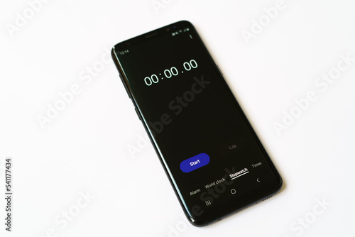 Stopwatch on smartphone screen on white background