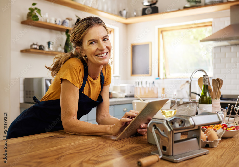 Tablet, kitchen and senior woman cooking recipe from website blog for home lunch, dinner or food and wine. Digital technology, internet search and old woman portrait chef with breakfast inspiration Tablet, kitchen and senior woman cooking recipe from website blog for home lunch, dinner or food and wine. Digital technology, internet search and old woman portrait chef with breakfast inspiration