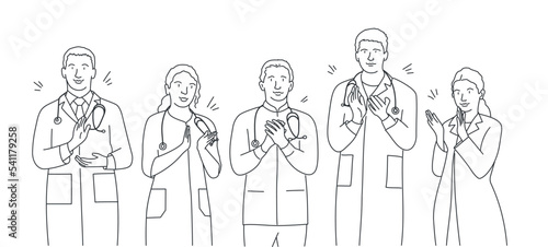 People in white medical uniform standing clapping hands and showing successful achievement. © Anna
