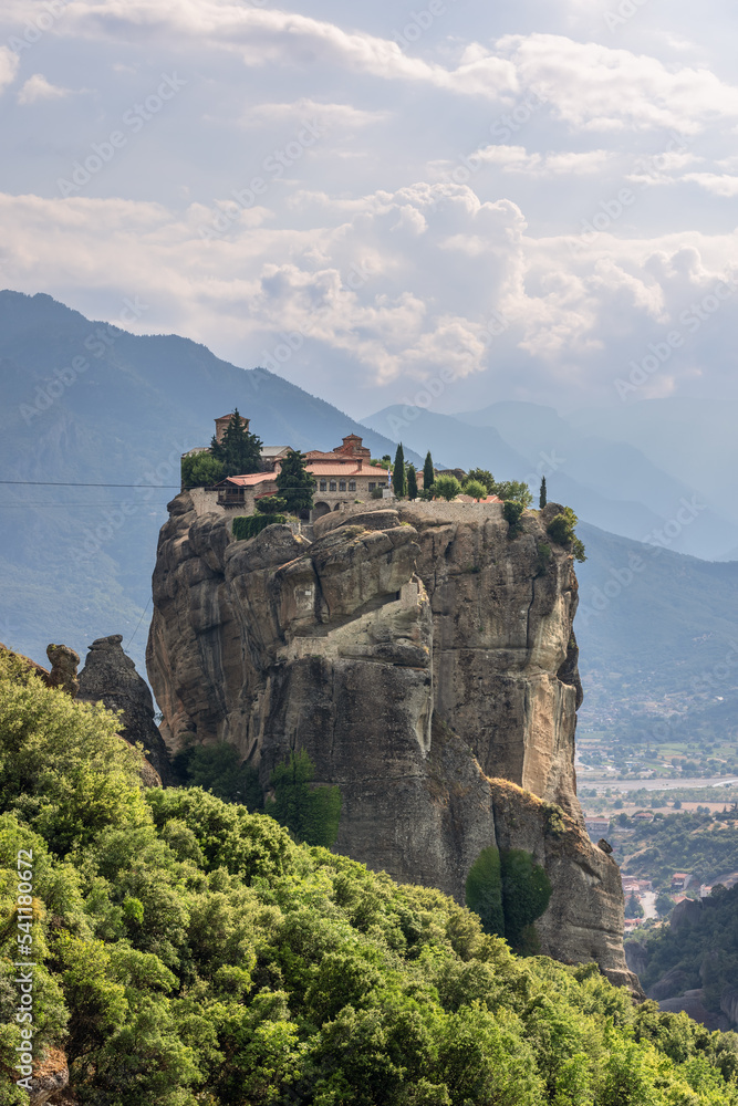 Vertical shot of an Eastern Orthodox monastery of the Holy Trinity in central Greece, situated in the Peneas Valley northeast of the town of Kalambaka on the top of a rocky precipice. Meteora, Greece