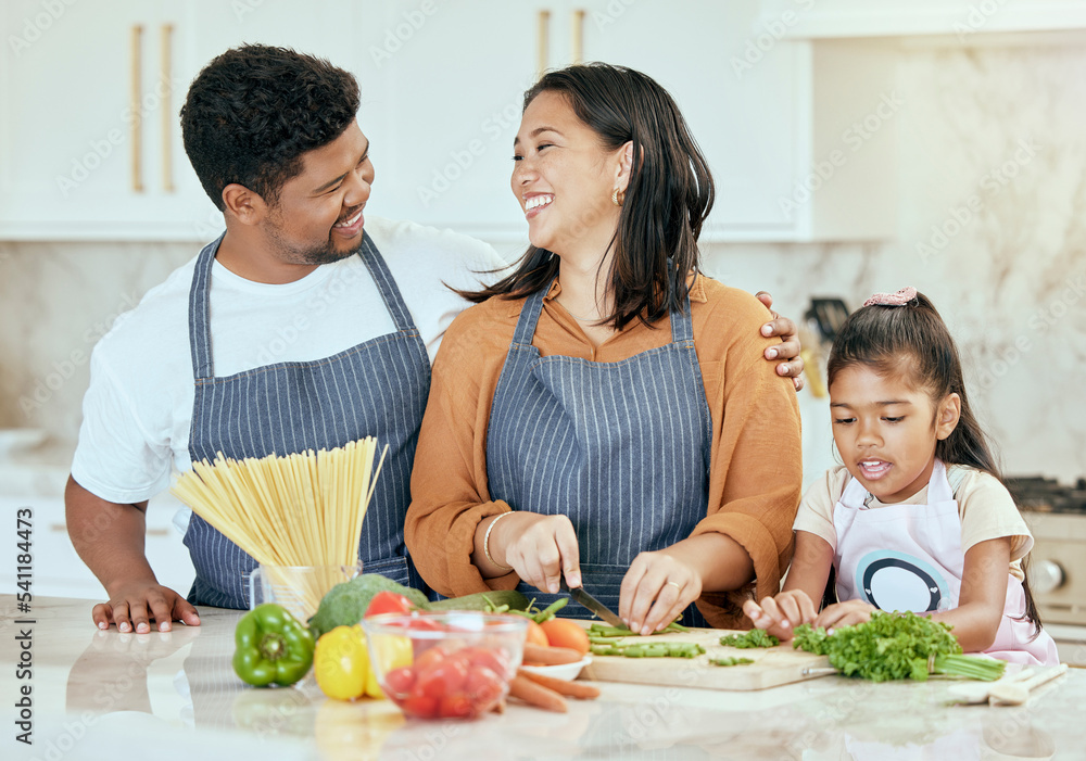 Cooking, kitchen and family with a girl, mother and father preparing food for a meal in their home together. Children, health and diet with a man, woman and daughter making dinner in a house Cooking, kitchen and family with a girl, mother and father preparing food for a meal in their home together. Children, health and diet with a man, woman and daughter making dinner in a house