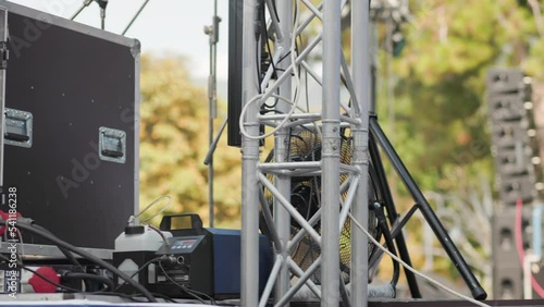Musical equipment and spotlights on the concert stage in the open air. Summer Jazz and Rock Festival.