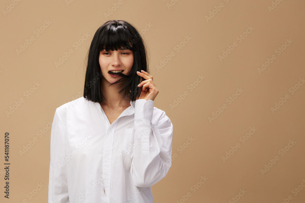 Happy enjoyed cute stylish adorable brunet lady in white shirt flirting smiling posing isolated on pastel beige studio background. Copy space Banner Offer. Pulp Fiction concept. Fashion Cinema Happy enjoyed cute stylish adorable brunet lady in white shirt flirting smiling posing isolated on pastel beige studio background. Copy space Banner Offer. Pulp Fiction concept. Fashion Cinema