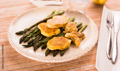 dietary meal rich in protein. Stir fried chicken breast and green asparagus