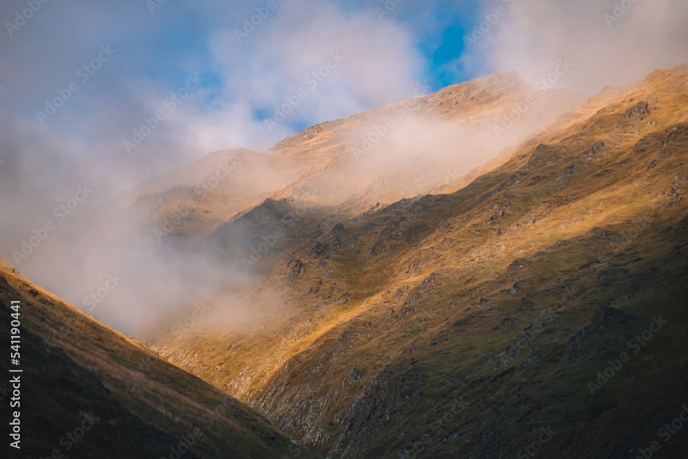 Fototapeta premium Foggy Sunset In The Mountains
