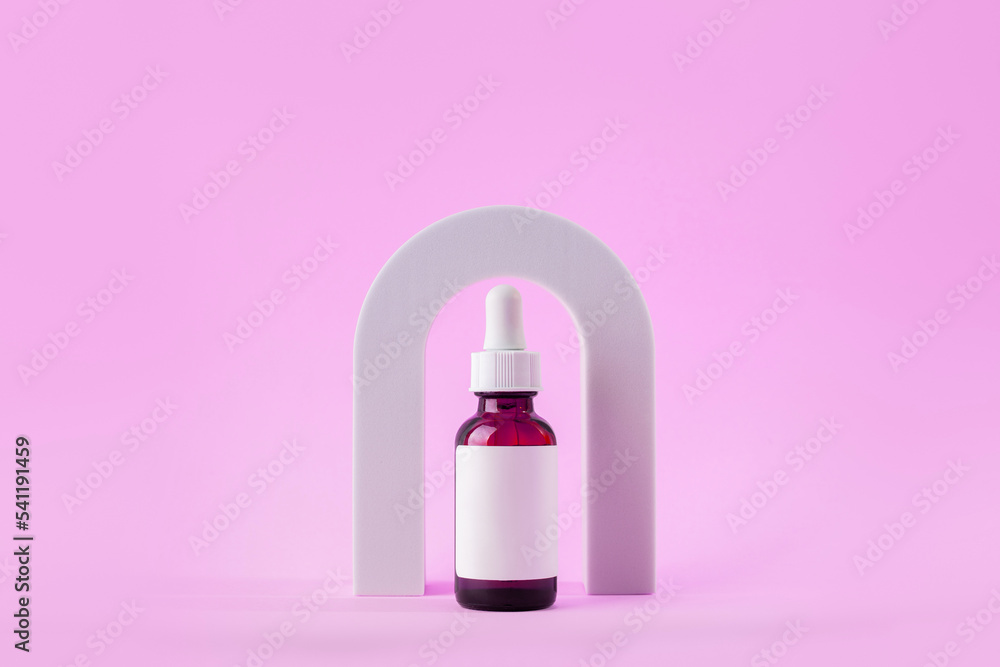 Cosmetic bottle with serum in arch. Skin care cosmetic. Hyaluronic acid oil, serum with collagen and peptides. Cosmetic bottle with serum in arch. Skin care cosmetic. Hyaluronic acid oil, serum with collagen and peptides.
