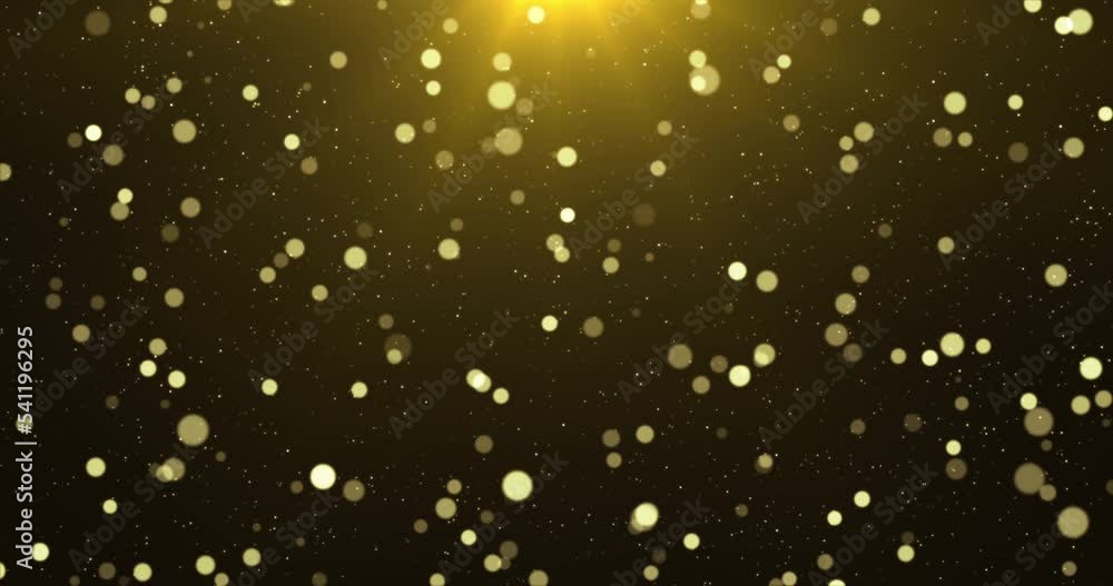 Golden luxury bokeh on particles floating in the air. Dust and glitter ...