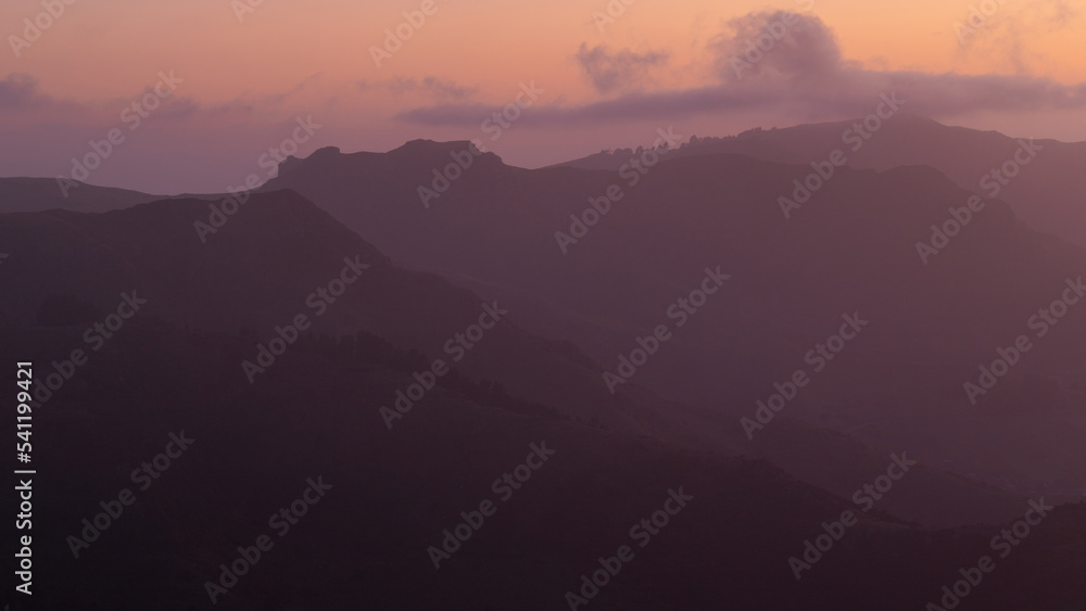 Foggy layer of mountains at sunrise time. Foggy layer of mountains at sunrise time.