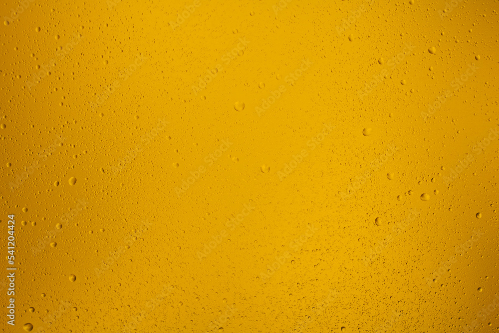 Glowing orange transparent background with contrasting water drops Glowing orange transparent background with contrasting water drops