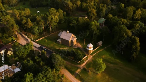 Aerial view of a historic old wooden church in the rural countryside of Salakas, in Paluse vilage, in Lithuania photo