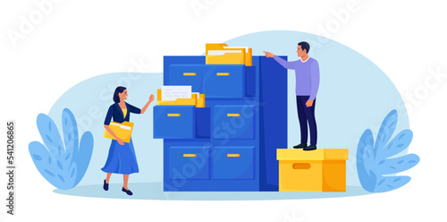 Document archiving and storage. Business people search files in archives. Support service, database. Men working with information, documents and statistics in analytical department. Folder in archive