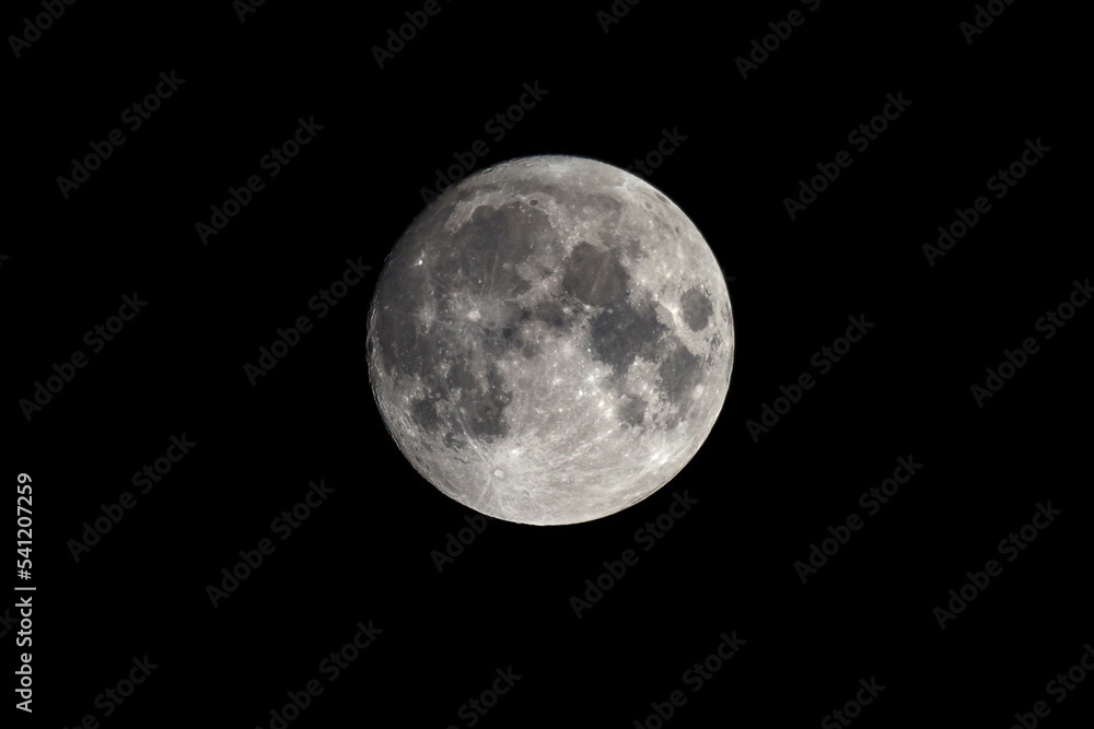 Moon in the night sky. Photograph of an Earth satellite through a telescope. Moon in the night sky. Photograph of an Earth satellite through a telescope.