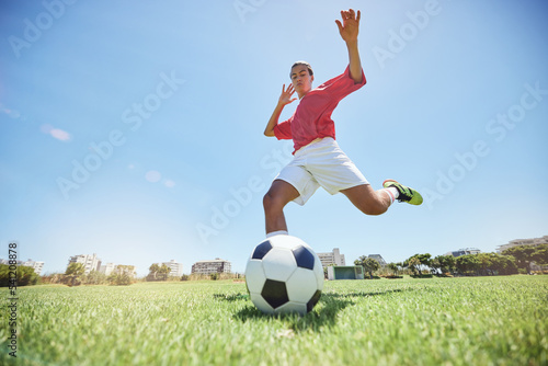 Soccer ball kick, sport and man athlete ready for team exercise, fitness and exercise game training. Football workout of a soccer player playing sport on an field in nature for cardio and wellness