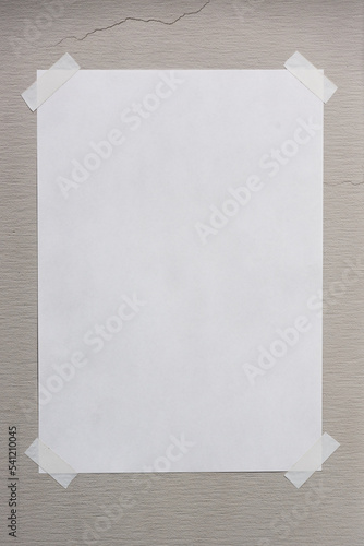 Blank paper taped on the wall