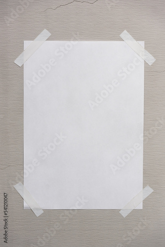 Blank paper taped on the wall