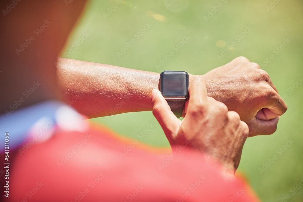 Smartwatch, screen mock up and fitness hands man check time running results, sports or training workout progress on green pitch field. Athlete on smart watch for exercise goal tech with green mockup