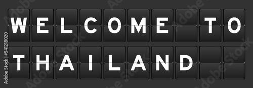 Black color analog flip board with word welcome to thailand on gray background