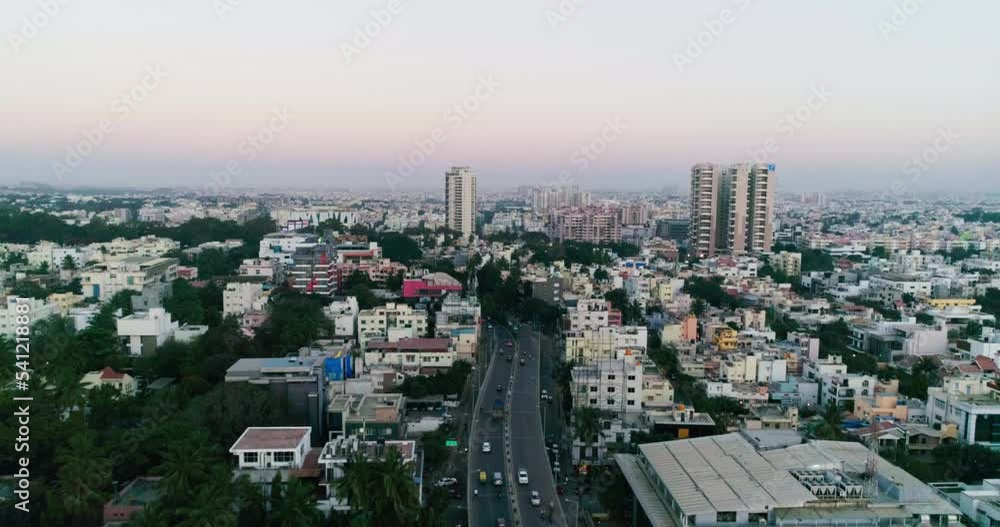 Aerial of city buildings,ring road and traffic at summer Aerial of city buildings,ring road and traffic at summer