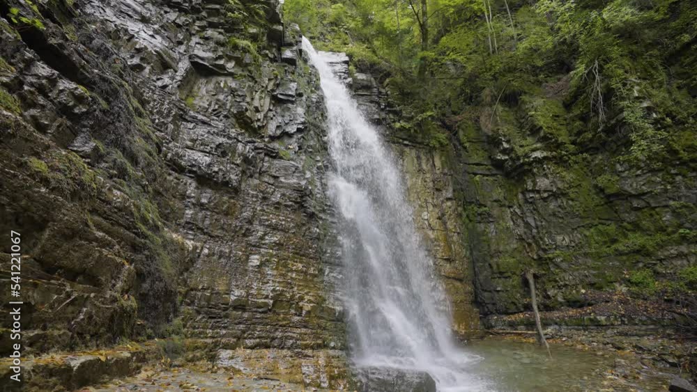 Beautiful waterfall in green forest, top view. Tropical in mountain forest. Waterfall in the mountain forest. Big Waterfall in 4k. Nobody landscape. Landmarks of Ukraine Beautiful waterfall in green forest, top view. Tropical in mountain forest. Waterfall in the mountain forest. Big Waterfall in 4k. Nobody landscape. Landmarks of Ukraine
