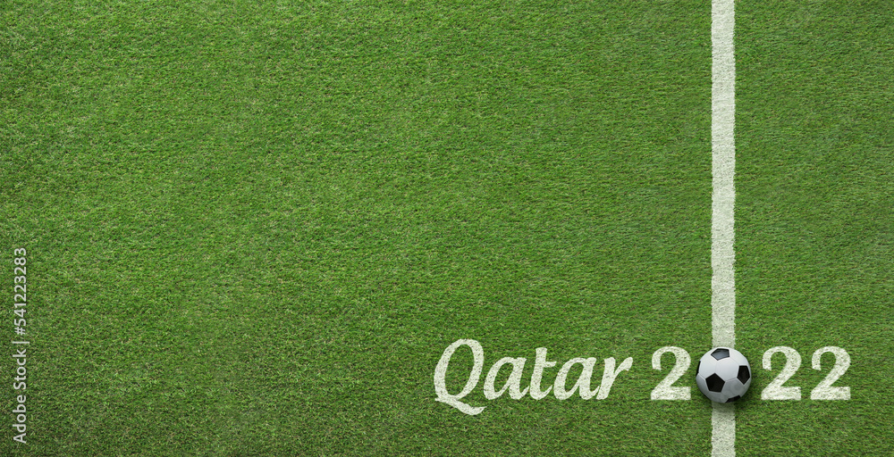 Grass background announcing soccer world cup tournament in Qatar 2022