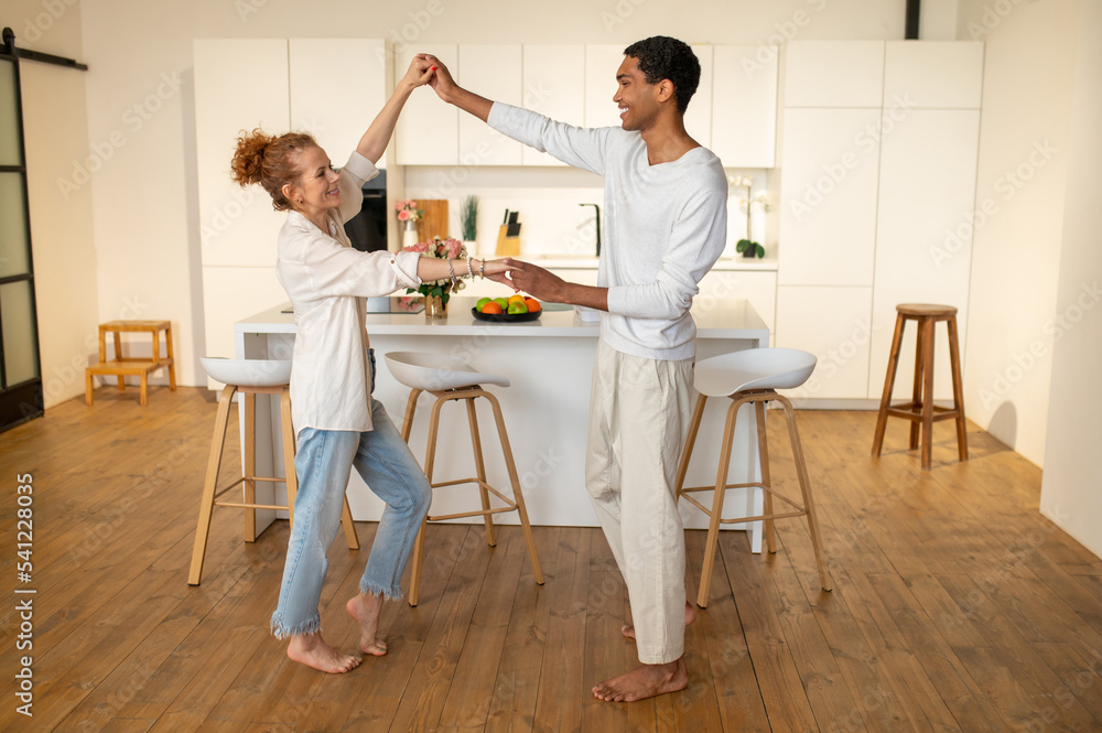 Fototapeta premium Happy young couple spending time at home