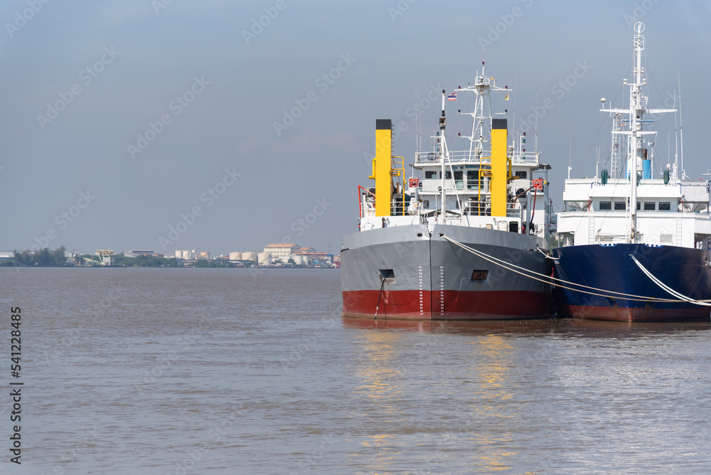 Two large ships docked in the harbor.