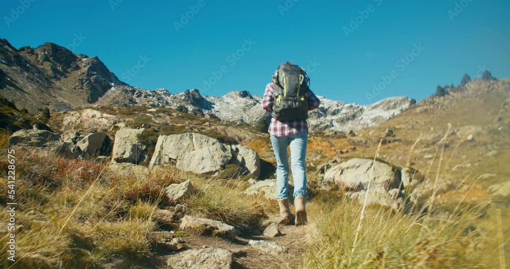 Following backpacker tourist on mountain vacation trip at sunny day and enjoy Following backpacker tourist on mountain vacation trip at sunny day and enjoy