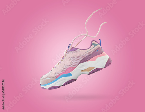 Flying colorful womens sneaker isolated on white background. Fashionable stylish sports shoes. Creative minimalistic footwear layout. Lifestyle product photo, levitation and urban style concept.