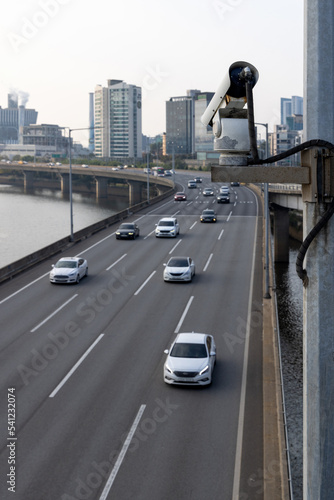 Photography Security camera on the bridge watching after the car traffic, and speed control