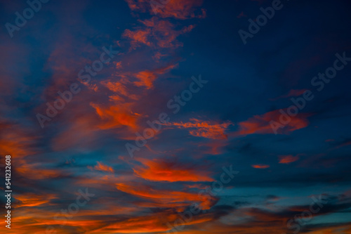 Dramatic vivid red with orange cloud sunset and sunrise sky.Beautiful sky on twilight time.Colorful sunrise with Clouds.