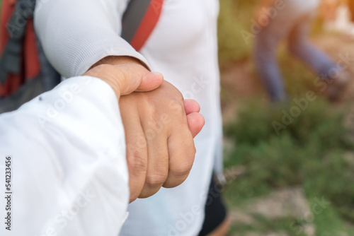 Romantic couple hands to travel, hold hands Follow me,Two lover holding together walking spend vacation summer together at outdoor, LGBT Loving couple and Shot caring of woman friendship