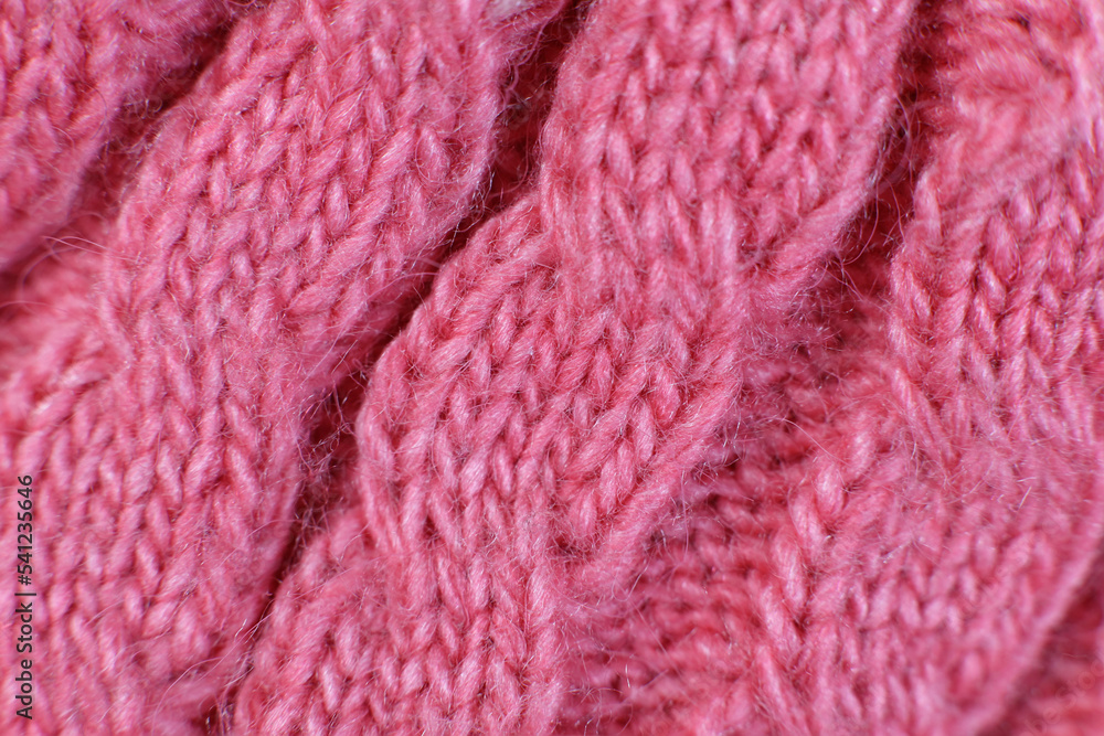 texture hand-knitted or machine knitting pattern braid. fabric background close-up texture hand-knitted or machine knitting pattern braid. fabric background close-up