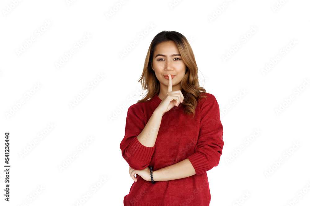 Excited confident asian happy woman in winter sweater red color isolated on white background. don't make noise Excited confident asian happy woman in winter sweater red color isolated on white background. don't make noise
