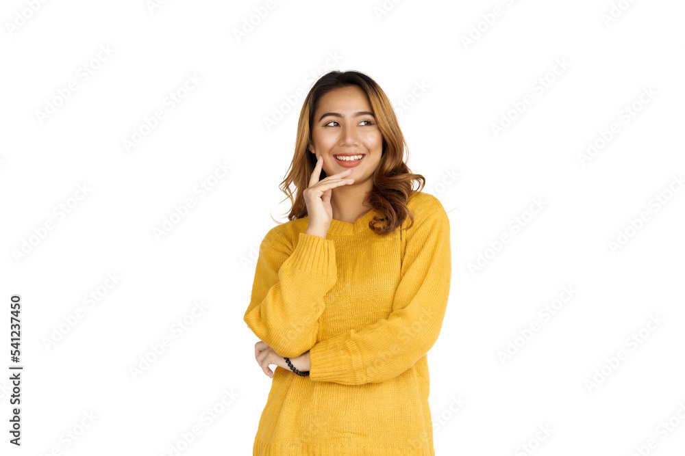 Attractive positive young asian brunette woman in yellow sweater on white background. Attractive positive young asian brunette woman in yellow sweater on white background.