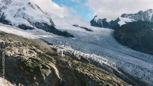 The Monte Rosa hut in Switzerland alps. Drone flight to the left