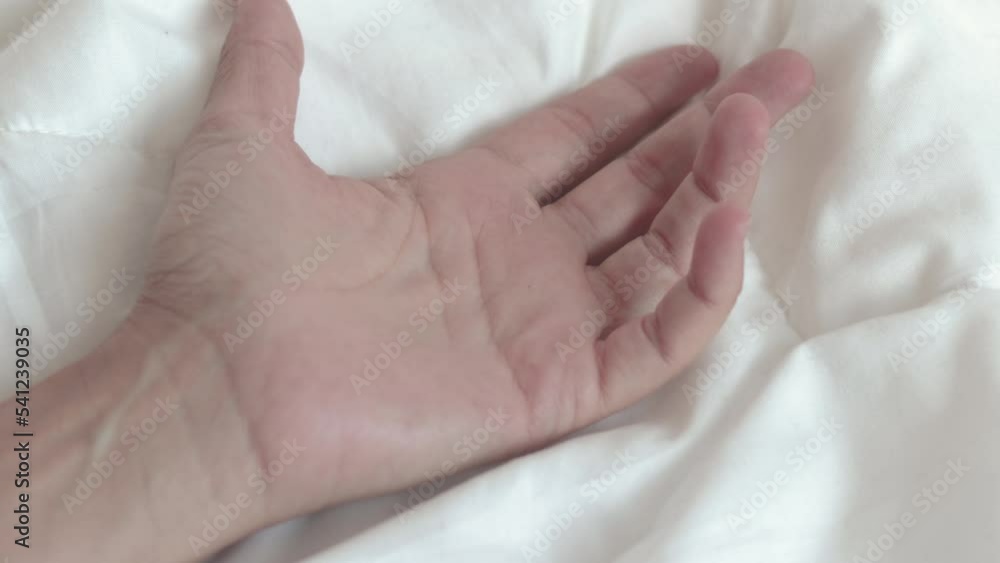 woman hand hold outstretched on white blanket morning bedroom interior.girl palm hold tight the cover.calm relaxed morning or sexual relationship concept 4k real time open palm move fingers young woman hand hold outstretched on white blanket morning bedroom interior.girl palm hold tight the cover.calm relaxed morning or sexual relationship concept 4k real time open palm move fingers young