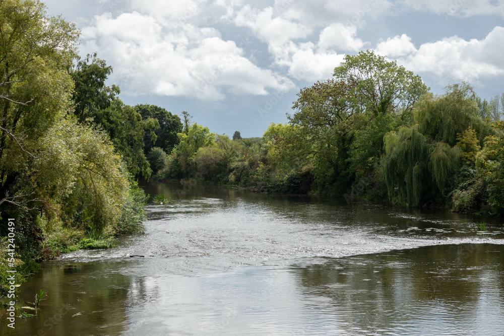 view of the River Exe from Trews Weir Suspension Bridge on a stormy Autumn day