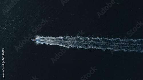 Aerial view of a fishermens on a speed motor boat fishing in the sea photo