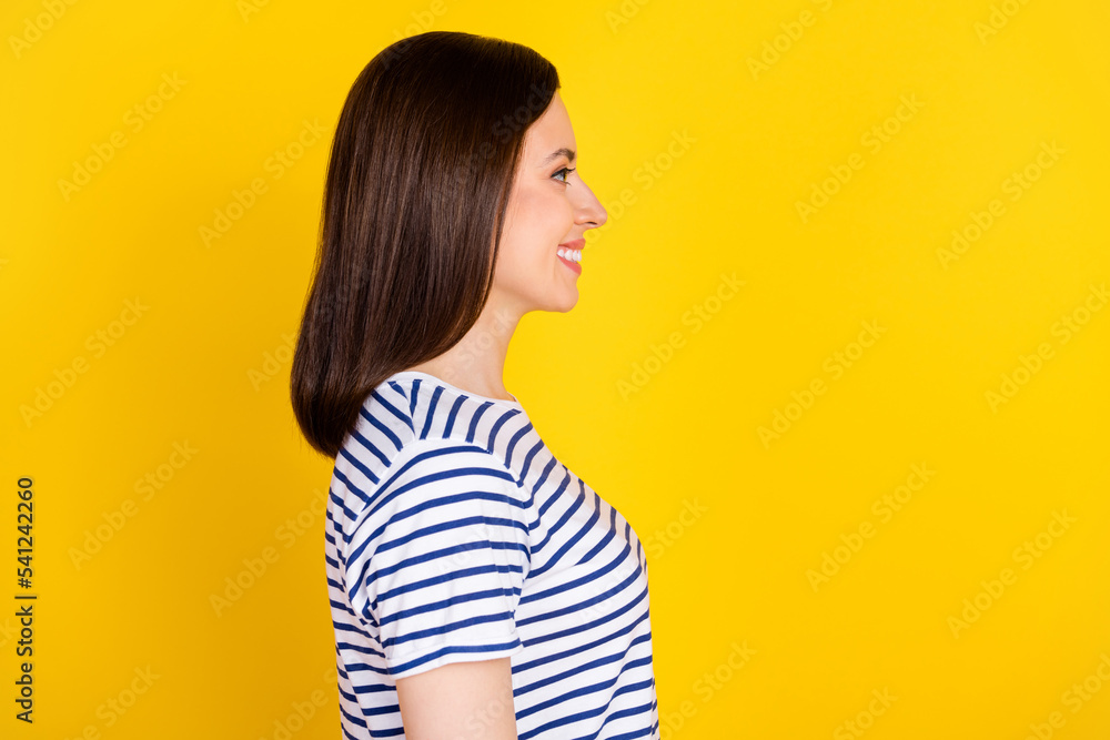 Profile side view photo of good looking lady look empty space rejoice new nice hairdo isolated on yellow color background Profile side view photo of good looking lady look empty space rejoice new nice hairdo isolated on yellow color background