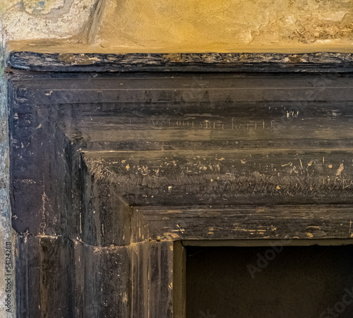Detail of old fireplace in a building in Italy