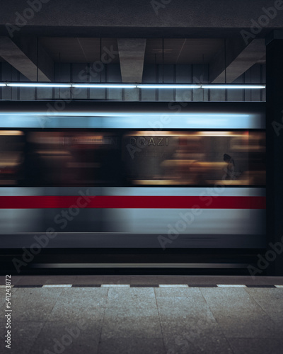 A man on further platform behind prague's subway train