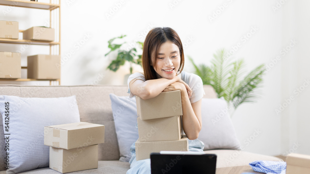 Small business owners or SMEs doing business related to selling and shipping online, New business style for young people working at home and owning businesses, Packing box, Sell online concept. Small business owners or SMEs doing business related to selling and shipping online, New business style for young people working at home and owning businesses, Packing box, Sell online concept.
