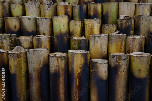 Khao Lam is a red or white glutinous rice that is put in a bamboo tube and then burned until cooked.
