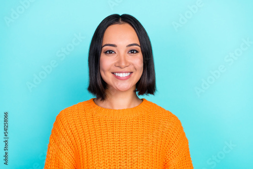 Photo of adorable gorgeous cheerful woman with bob hairdo dressed orange pullover dental advert isolated on turquoise color background