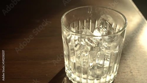 Pour the drip coffee into a glass with ice.