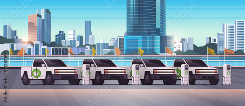 electric pickup truck cars charging parking at the charger station with a plug in cable electrified transportation e-motion